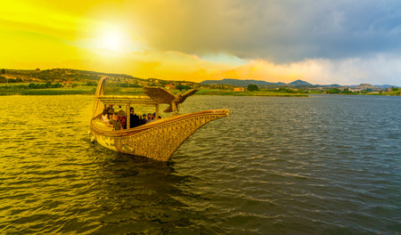 Ihsaniye, Afyonkarahisar/Turkey-June 08 2019: Boat in Lake Emre in sunset, Phrygia Valley Natural Park (Frig Vadisi Tabiat Parki) sunset in Phrygia Valley Natural Park (Frig Vadisi Tabiat Parki)のeditorial素材