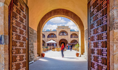 Beypazari, Ankara/Turkey- March 31 2019:Woman watches inside from the entrance of Suluhan Caravanseraiのeditorial素材