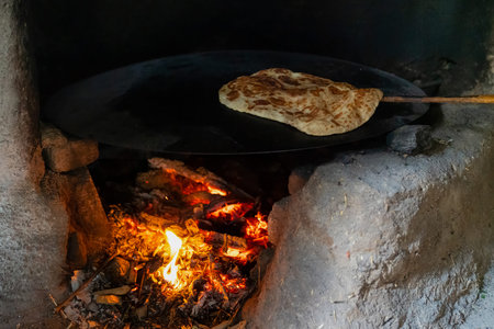 Making gozleme bread on wooden fire in rural  region in Turkey