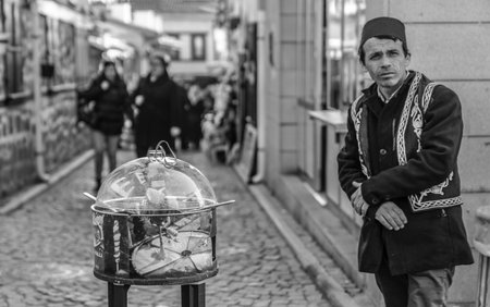Ankara/Turkey-February 17 2019:  Man sells Ottoman paste Turkish traditional sweet macun ( Turkish Geleneksel osmanli macunu) around Ankara Castle (Ankara Kalesi)のeditorial素材