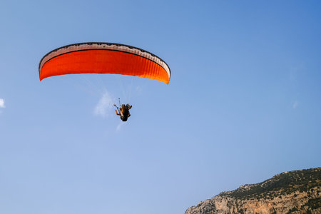 Fethiye, Mugla/Turkey- August 19 2018: Bottom up view of tandem paragliders on sky.のeditorial素材