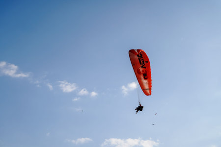 Fethiye, Mugla/Turkey- August 19 2018: Bottom up view of tandem paragliders on sky.