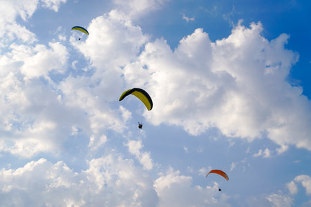 Fethiye, Mugla/Turkey- August 19 2018: Bottom up view of tandem paragliders on sky.のeditorial素材