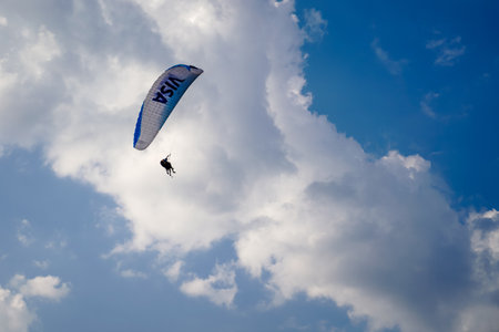 Fethiye, Mugla/Turkey- August 19 2018: Bottom up view of tandem paragliders on sky.のeditorial素材