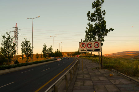 Ankara/Turkey-July 04 2020: Car on the traffic at sunset and there are speed limitation sign on the...