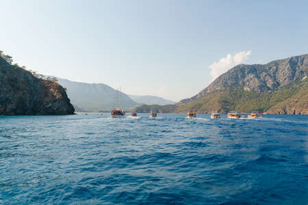 Adrasan, Antalya/Turkey-September 25 2020: Tour boats carrying tourists travel in the Mediterranean as a group.の写真素材