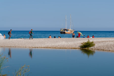 Olimpos, Antalya/Turkey-September 24 2020: People enjoy sea and sand in summer just near ancient city. Freshwater and sea in background.のeditorial素材