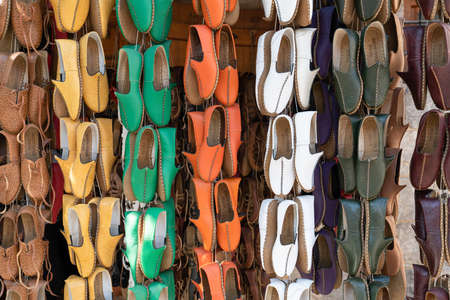 Gaziantep, Turkey-September 14 2020: Traditional handmade shoe Yemeni hanging in front of the shop.の写真素材