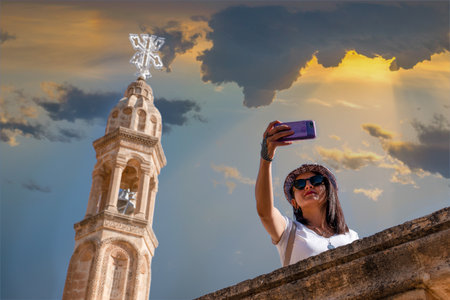 Midyat, Mardin, Turkey- September 17 2020: Tourist girl taking selfie in Mor Gabriel Monasteryのeditorial素材