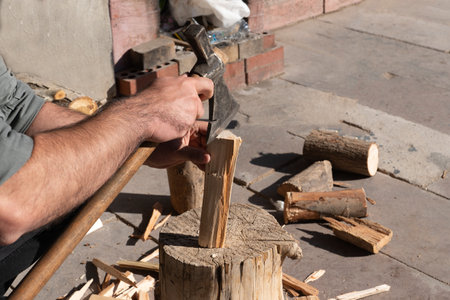 Man chopping wood with an ax.の写真素材