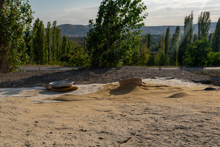 Preparing bulgur on ground. Ankara, Turkey.の写真素材