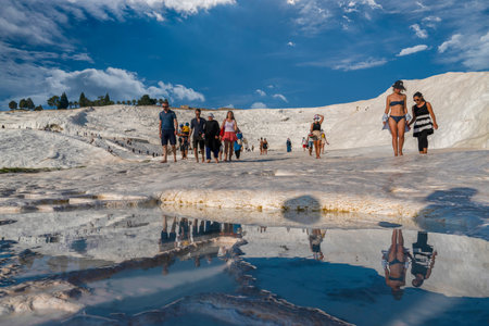 Pamukkale, Denizli, Turkey - August 26 2021:Tourists enjoy taking photos, watching scenic view and bathing at cotton castle.のeditorial素材