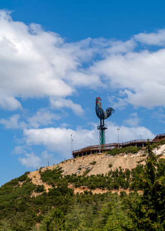 Pamukkale, Denizli, Turkey - August 26 2021: The giant metal rooster, which was built in the urban forest (Kent Ormani in Turkish) and is the symbol of Denizli City.のeditorial素材