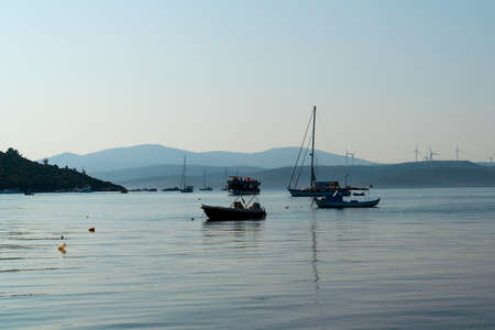 Panoramic view of town Sigacik with boats and sea.の写真素材