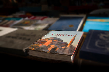 Ankara, Turkey - November 21 2021: Blurred books and magazines at the flea market on sale. Book about Turkey is on sale at the flea market.のeditorial素材