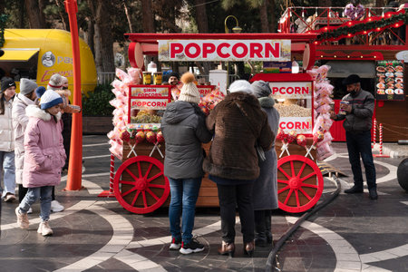 Baku, Azerbaijan - January 03 2022-Popcorn seller and customers.のeditorial素材