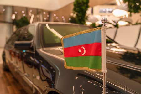 Tricolor, with a white crescent and an eight-pointed star in the center. Flag of Azerbaijan at the...