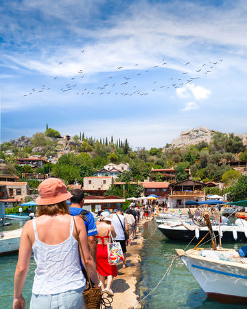 Tourists getting off the boat and visiting the ancient city of Simenaの写真素材