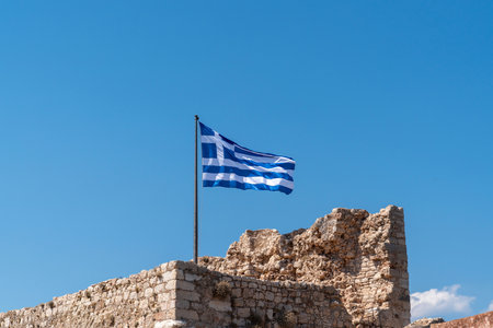 Greek flag waving in Kastellorizo castle, Kastellorizo island, Dodekanisos, Greeceの写真素材
