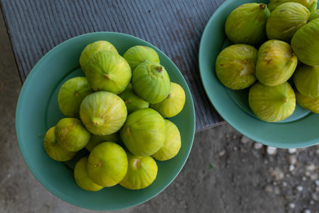 Top view of green figs in a plate are ready to eat in the country.の写真素材
