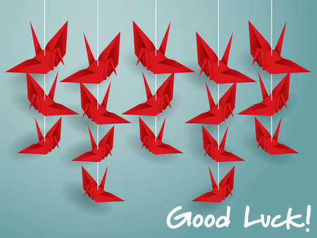 Vector illustration of hanging origami paper cranes in red color and "Good Luck!" text on blue background. Flat design style.のイラスト素材