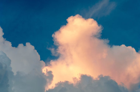 Thick clouds glowing as the sun rises at dawn