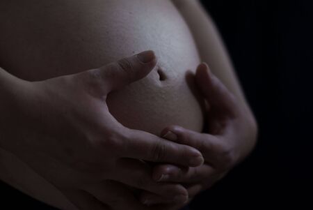 Pregnant women who are embracingの写真素材