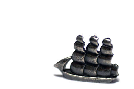 Close-up of tin ship from parlour gameの写真素材