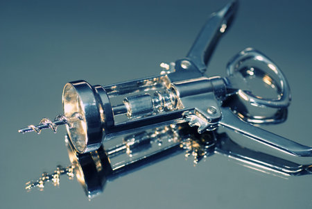 Bottle opener, close up on reflected backgroundの写真素材