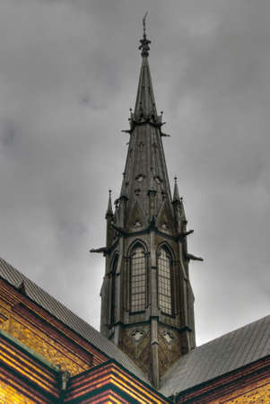 Dramatic picture of tower in Gothic style at Uppsala Cathedralの写真素材