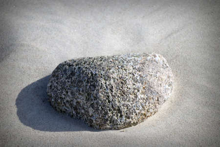 Close up of stone on the sandy beachの写真素材