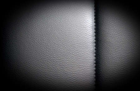 Black dark leather background, texture with vignetteの写真素材