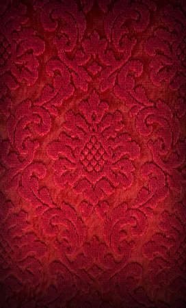 Old red brocade fabric pattern backgroundの写真素材