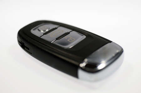 Close up of modern wireless car key isolated on whiteの写真素材