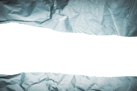 Close up of torn blue paper with copy spaceの写真素材