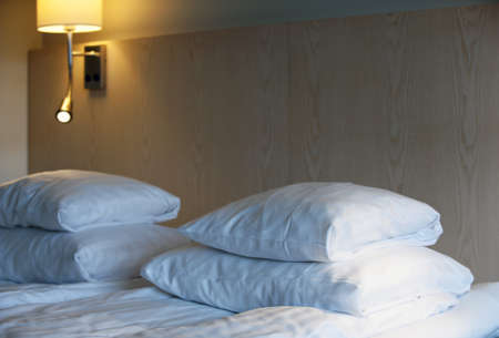 Double bed in the hotel roomの写真素材