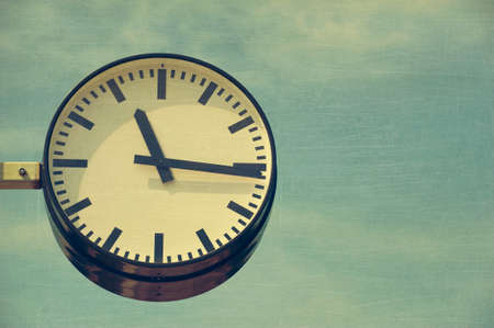 City clock, aged and worn vintage style photoの写真素材