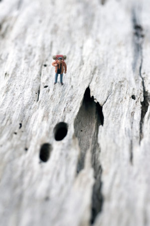 Male hiker with a hole in the path, miniature figureの写真素材