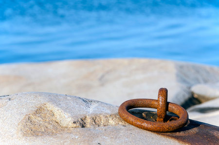 old rusty ring on the cliff in the archipelagoの写真素材