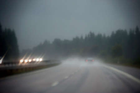 Cars driving in the rainの写真素材