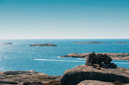 Blue sky and sea, sailboats in rocky archipelago on the west coast of swedenの写真素材