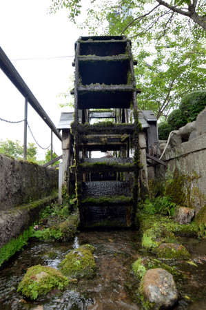Japan's Secret Garden and water wheelの写真素材
