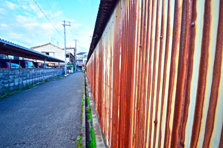 Old door of the shutter and the town.の写真素材