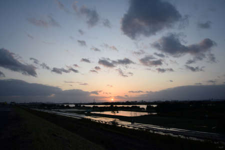 River and the sunset after the typhoon.の写真素材