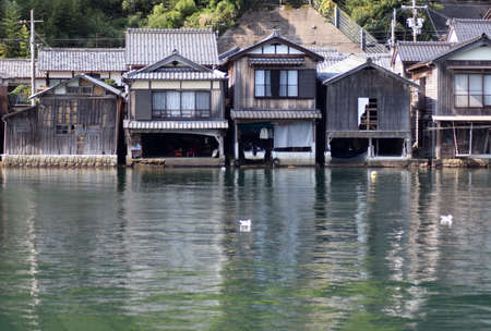 Traditional Japanese houses and the sea of Kyotoの写真素材