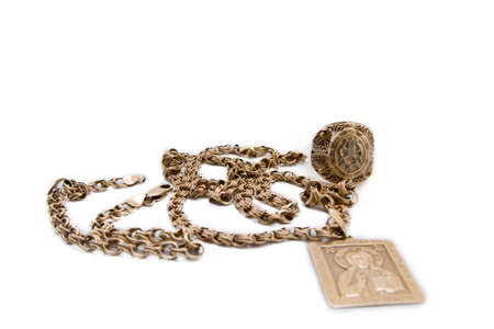 Gold chain, ring and pendant isolated on the whiteの写真素材