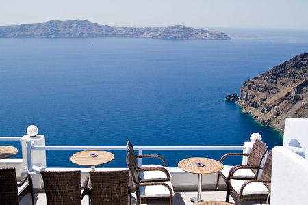 sunterrace with a view at the caldera, Santorini   Greeceの写真素材