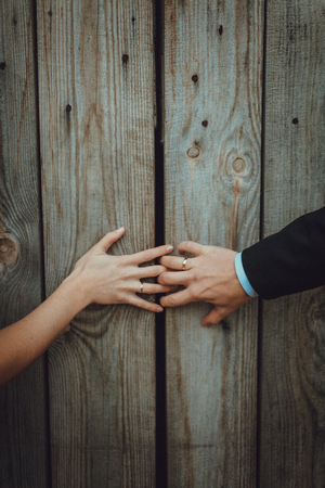 Close up of just married hands opening the door togetherの写真素材