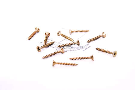 Screws and nails are used in the everyday craft, however, also in the domestic, screws hold together piece of furniture and nails hold pictures on the wall.の写真素材