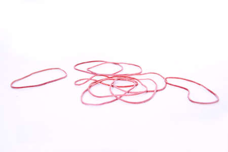 An elastic band (also: Elastic ring) a short piece of rubber or latex is in ring form. Such tapes are ordinarily used to hold together several objects. The elastic band was patented on the 17th March, 1845 in England by Stephen Perry.の写真素材